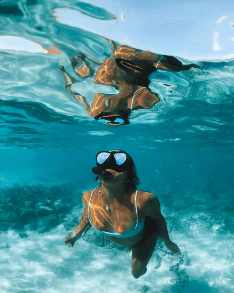 woman with rental snorkeling in maui