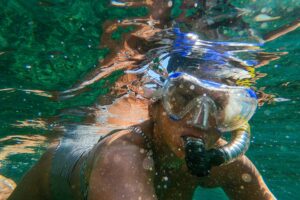 person underwater snorkeling