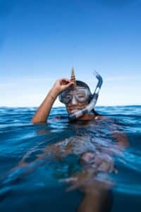 person above water with snorkel on